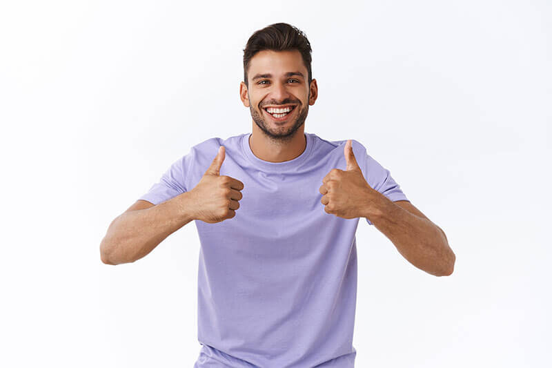 guy giving two thumbs up after visiting our Northridge dentist