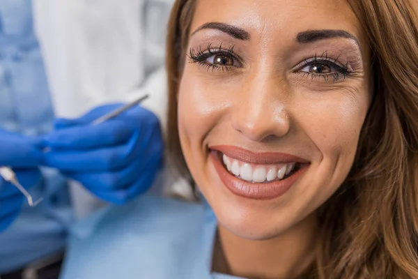 Woman smiling at the dentist