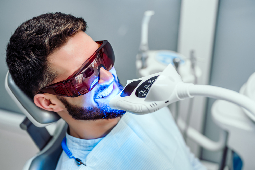 patient getting his teeth whitened